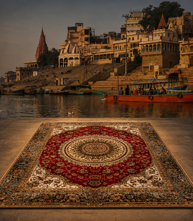 The Dawn Collection — a deep crimson medallion rug on the ghat steps