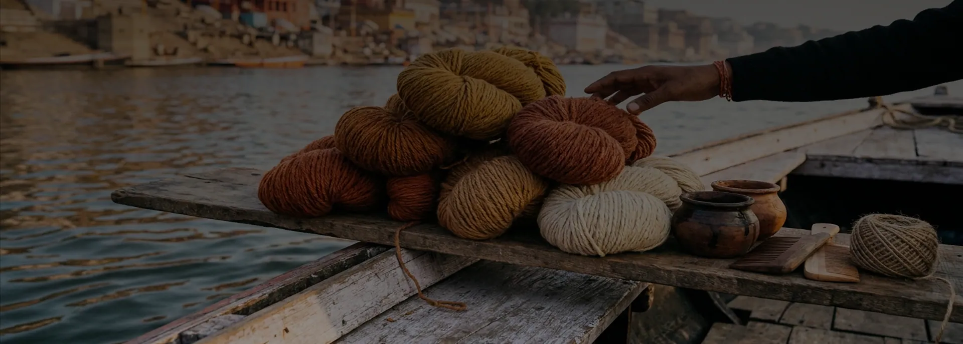 Skeins of hand-dyed wool stacked on a boat at the ghats