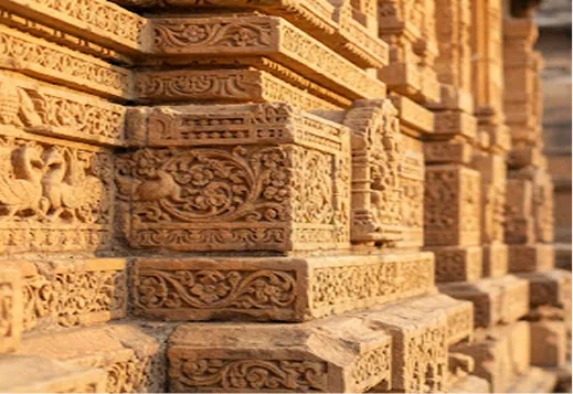 Carved sandstone relief on a Bhadohi temple wall