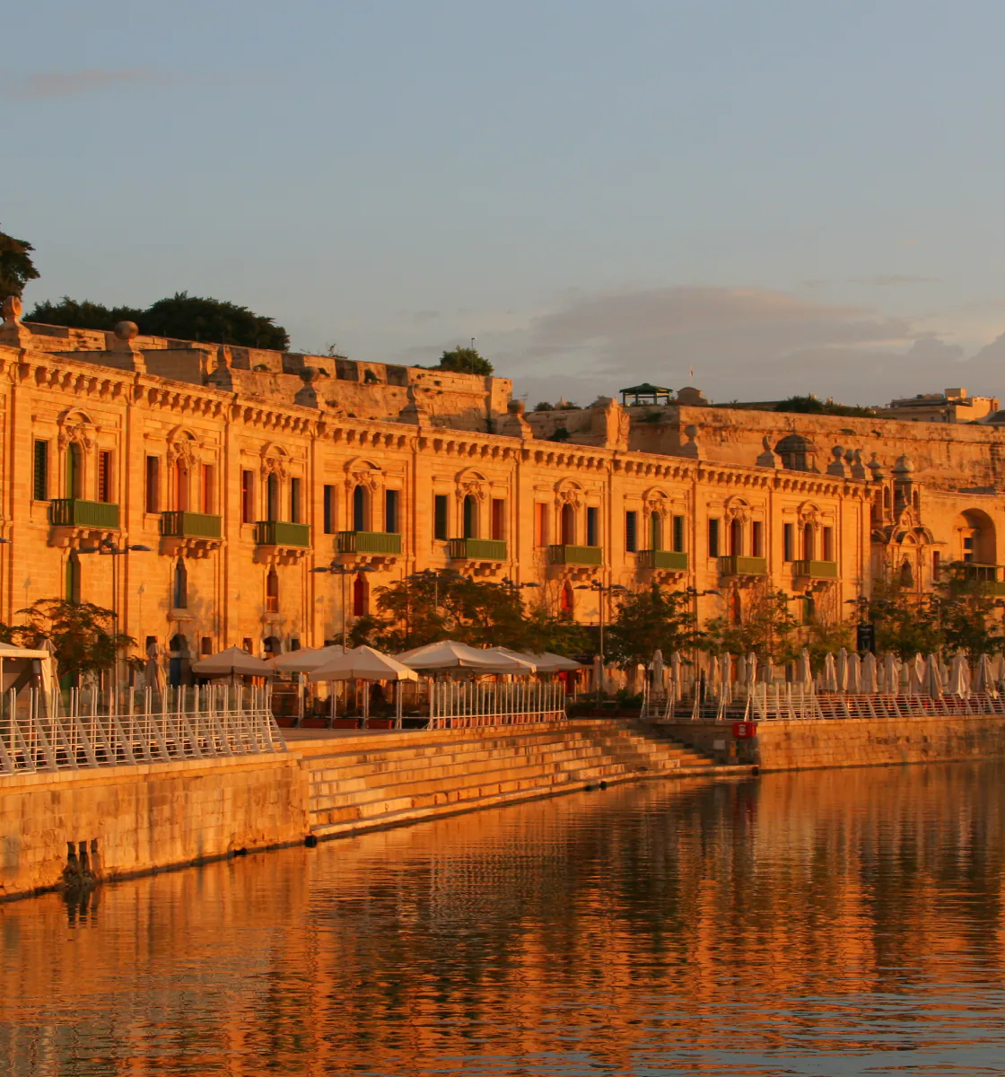 Golden evening light across a Rajasthani waterfront palace